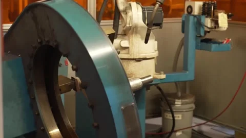 Robotic welding arm operating with C-shaped positioner rotating washing machine Stock Footage 334966067