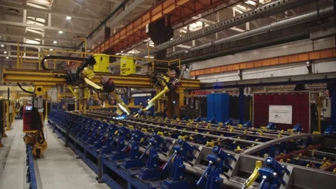 Robotic welding arms weld structures at the production plant. laser automated Stock Footage 202049690