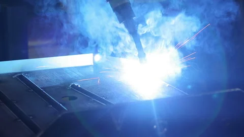 Robotic welding machine in the factory. From welding sparks flying bright. Dange Stock Footage 199486780
