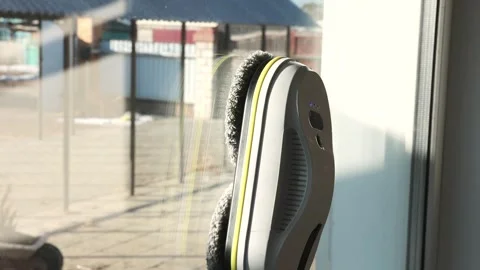 Robotic window cleaner on large glass surface, smart cleaning gadget, concept of Video stock 307411510