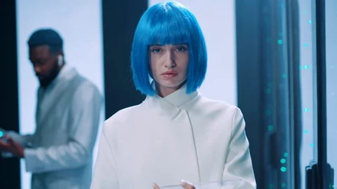 Robotic woman IT admin walking inside server cabinet, opening supercomputer for Stock Footage 121121937