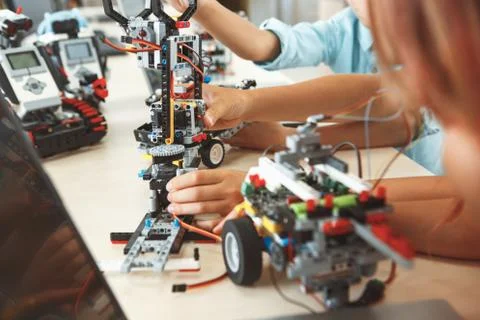 Robotics. Children having class making robots close-up Stock Photos