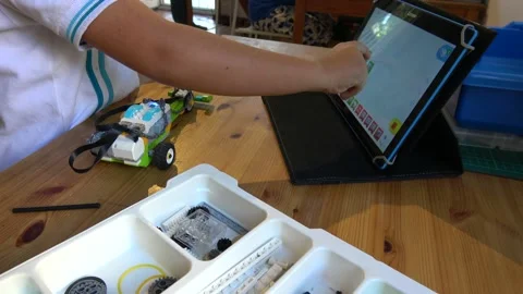 At robotics classes children construct robots using computer programmes Stock Footage 163431666