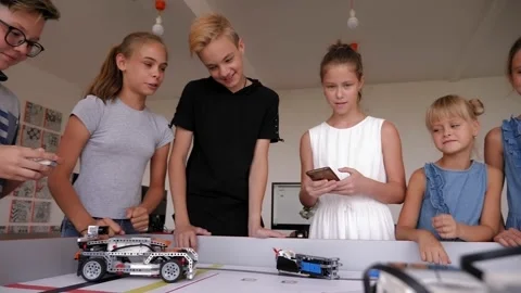 Robotics competitions. A group of children assembled robots from plastic parts. Stock Footage 142079343