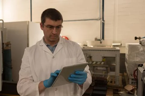 Robotics engineer using digital tablet Stock Photos