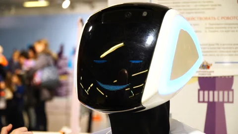 Robotics Expo. Modern technologies. Robot face close up. Robot talk with man 4k Stock Footage 89511151