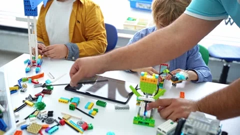 Robotics programming class. Children construct and code Robot. STEM education Stock Footage 235783870