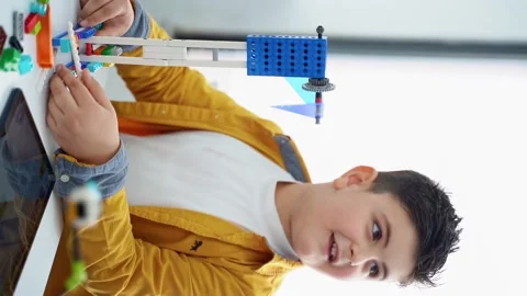 Robotics programming class. Children construct and code Robot. STEM education Stock Footage 235783917