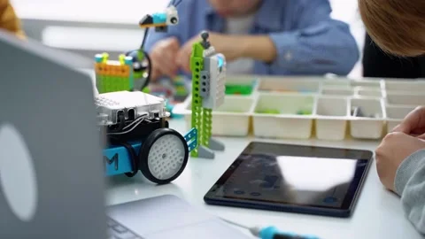Robotics programming class. Children construct and code Robot. STEM education Stock Footage 236315597