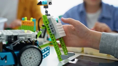 Robotics programming class. Children construct and code Robot. STEM education Stock Footage 236315641