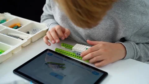 Robotics programming class. Children construct and code Robot. STEM education Stock Footage 238699166