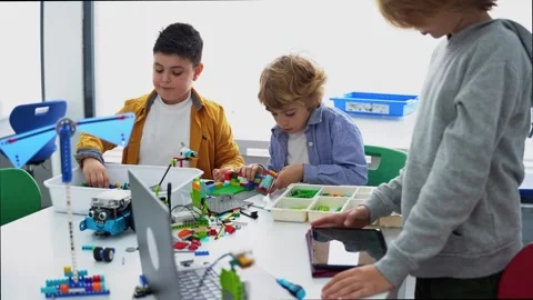 Robotics programming class. Children construct and code Robot. STEM education Stock Footage 241149627