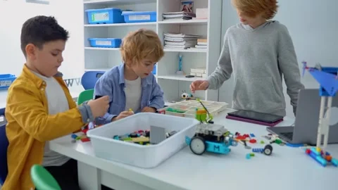 Robotics programming class. Children construct and code Robot. STEM education Stock Footage 241149644