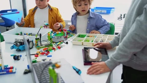 Robotics programming class. Children construct and code Robot. STEM education Stock Footage 241692399