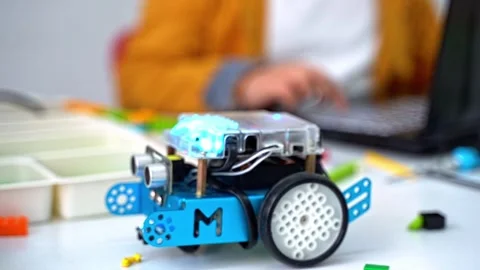 Robotics programming class. Children construct Mbot and code Robot. STEM Stock Footage 246124836