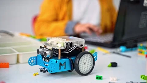 Robotics programming class. Children construct Mbot and code Robot. STEM Stock Footage 246124845