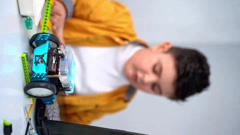 Robotics programming class. Children construct Mbot and code Robot. STEM Stock Footage 246124851