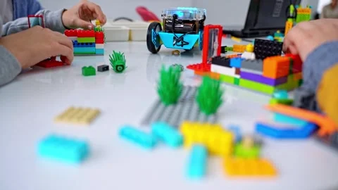 Robotics programming class. Children construct and code Robot. STEM education Stock Footage 246124926
