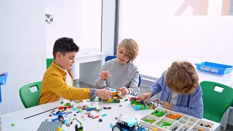 Robotics programming class. Children construct and code Robot. STEM education Stock Footage 246854070