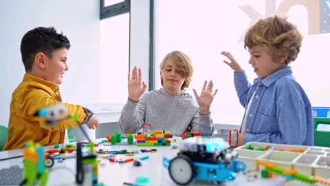Robotics programming class. Children construct and code Robot. STEM education Stock Footage 249760689