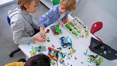 Robotics programming class. Children construct and code Robot. STEM education Stock Footage 251735352