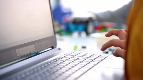 Robotics programming class. Close up hands Children construct and code Robot Stock Footage 247197554