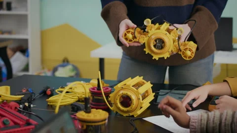 Robotics Showing Different Robots to Kids during Robotics Lesson Stock Footage 304145040