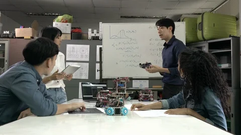 Robotics team meeting and collaborating development robot in modern laboratory. 스톡 동영상 113706293