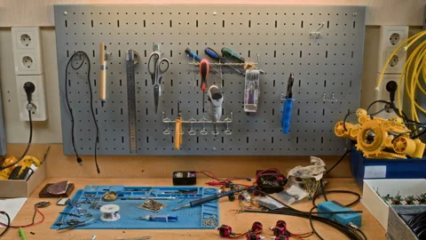 Robotics Workshop Table Displaying Tools, Electronic Components Stock Footage 343502092
