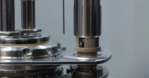 Robotized machine tool corks small glass vial with rubber cap in modern Stock-Footage 346231687