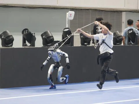 Robots and engineers prepare for 2nd World Humanoid Robot Games in Beijing Stock Photos