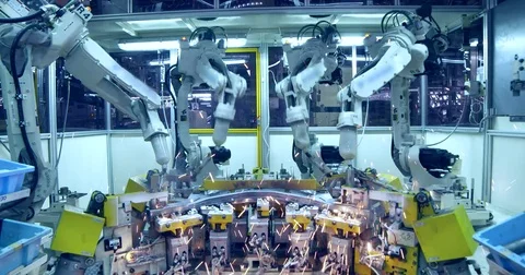 Robots are welding car in automobile factory Stock Footage