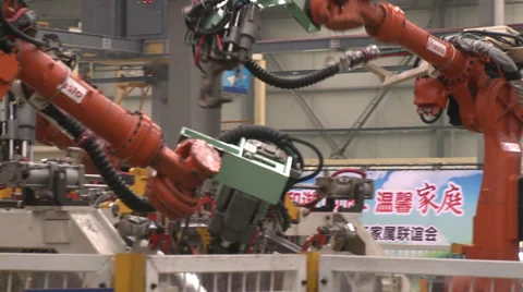 Robots arms welding and assemble cars Stock Footage 38182030