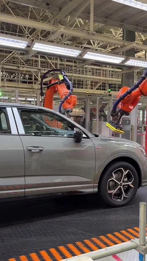 Robots Assembling New Energy Vehicles on Production Line in China Stock Footage 337802648