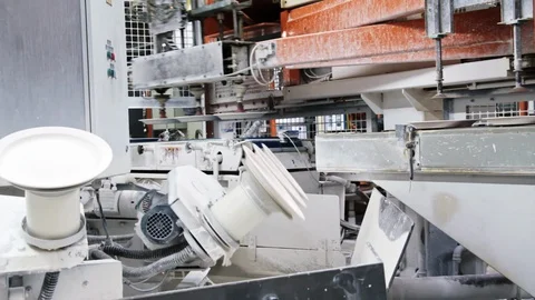 Robots coat plates and pass them on. Stock Footage 129028720