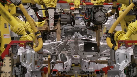 Robots collect and weld car bodies at the car factory Stock Footage 92197301