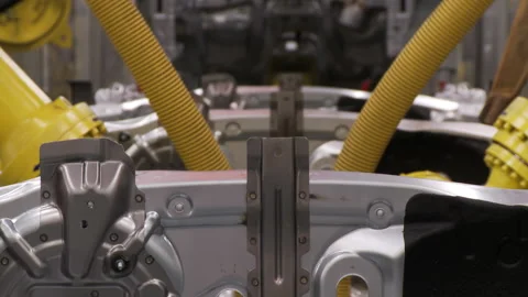 Robots collect and weld car bodies at the car factory Stock Footage 92197325