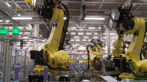 Robots collect and weld car bodies at the car factory Stock Footage 92197360