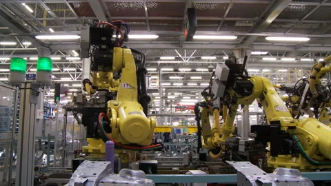 Robots collect and weld car bodies at the car factory Stock Footage 92197422