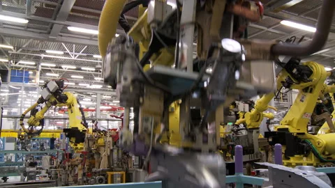 Robots collect and weld car bodies at the car factory Stock Footage 92197438