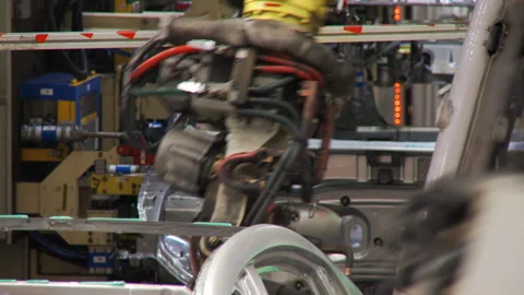 Robots collect and weld car bodies at the car factory Stock Footage 92197758