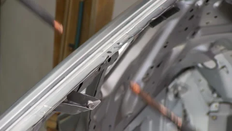 Robots collect and weld car bodies at the car factory Stock Footage 92197766