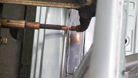 Robots collect and weld car bodies at the car factory Stock Footage 92197780