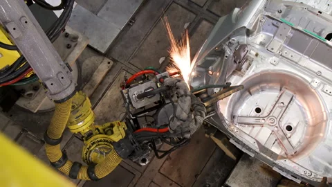 Robots collect and weld car bodies at the car factory Stock Footage 92197789