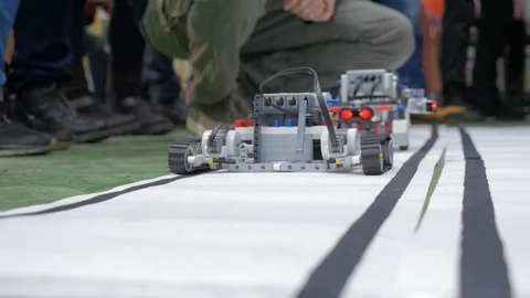 Robots drive on the road. Programming, innovation Stock Footage 85552399