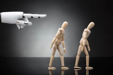 Robot's Hand Giving Direction To Two Wooden Dummies Stock Photos