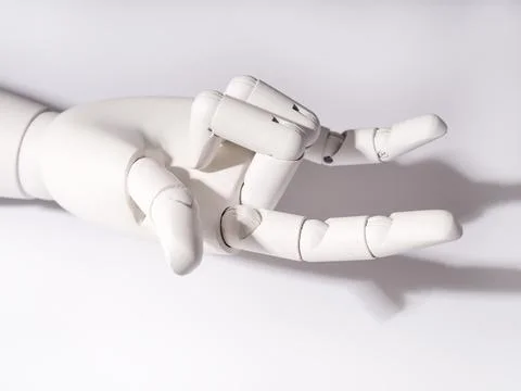The robot's hand is on a white background Stock Photos