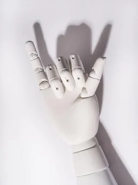 The robot's hand is on a white background 스톡 사진