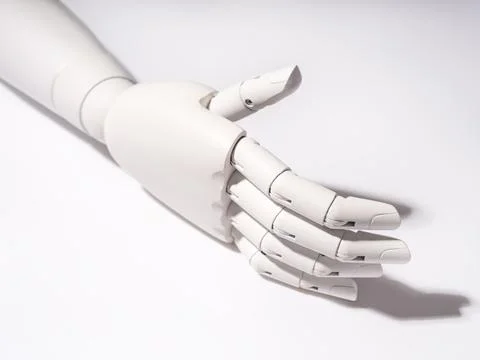 The robot's hand is on a white background 스톡 사진