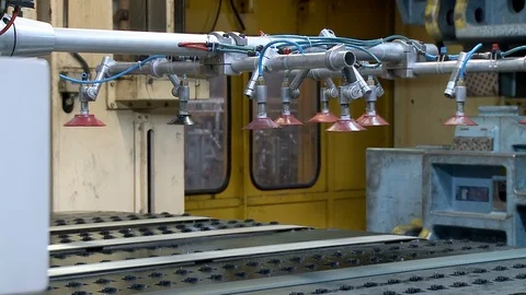 Robots move metal plates to molding machine inside Khodro car factory, Iran Stock Footage 119158239